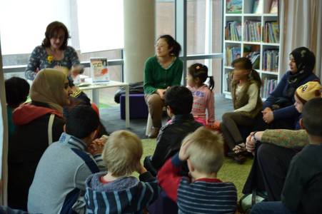 Wendy reading to children at Cardiff Central Library